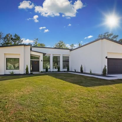 The Saba Residence — modern white custom home in Katy, Texas